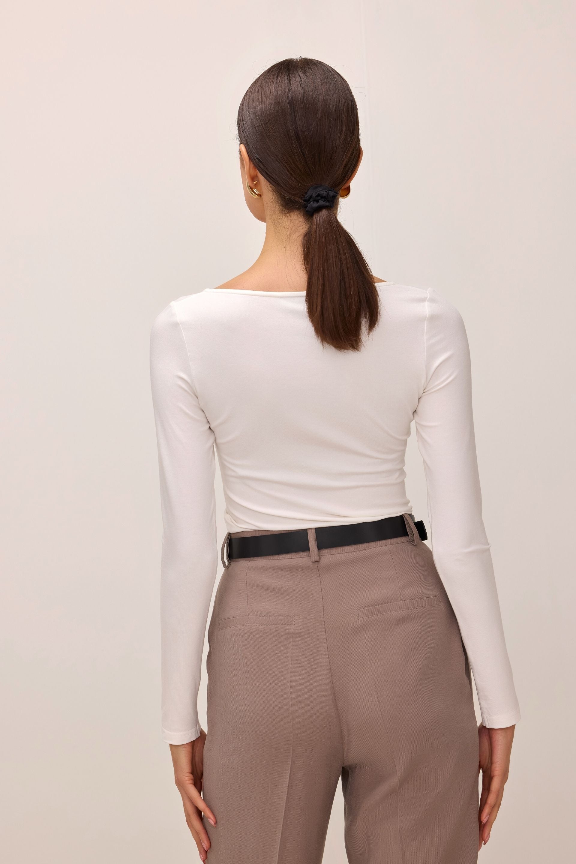 Cream blouse with a large round neckline