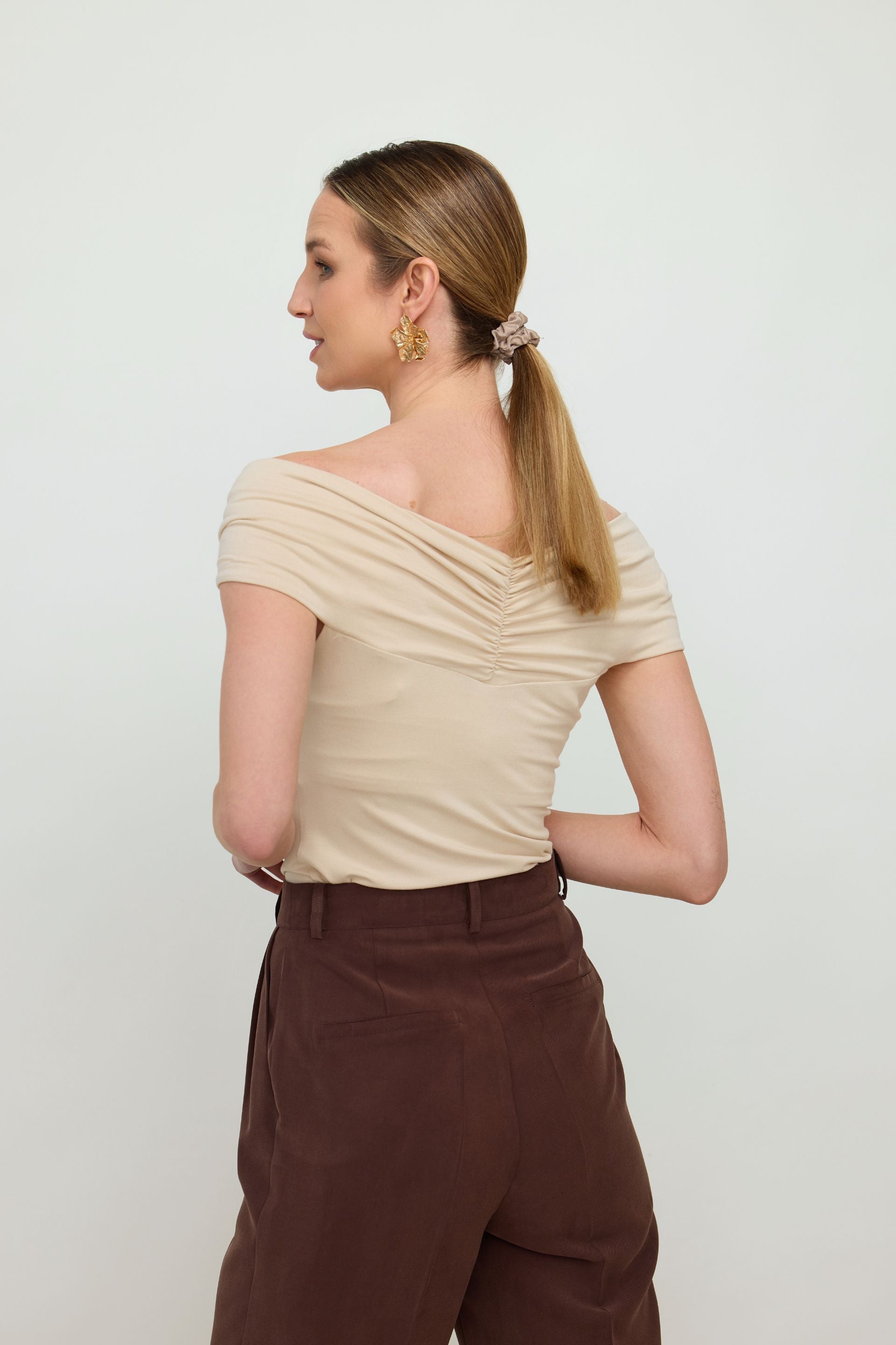Red off-the-shoulder blouse with a roll-up