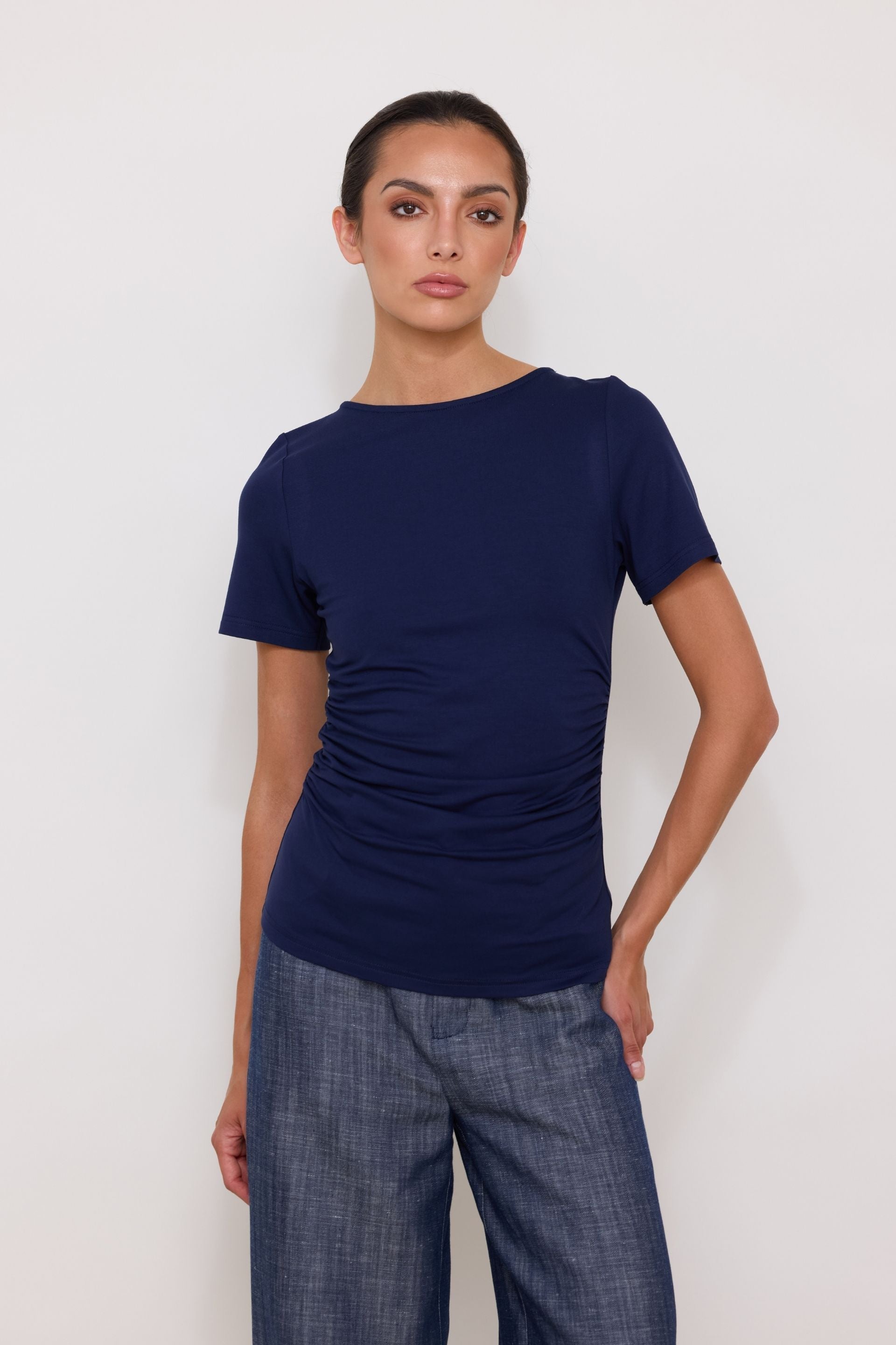Navy blue short-sleeved blouse with draped sides